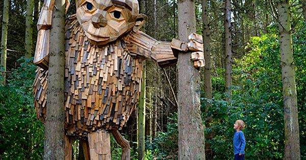 Artist Creates Wooden Giants And Hides Them In The Wilderness
