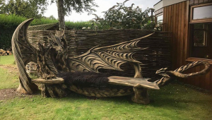 Estonian Chainsaw Master Carves A Fascinating Dragon Bench